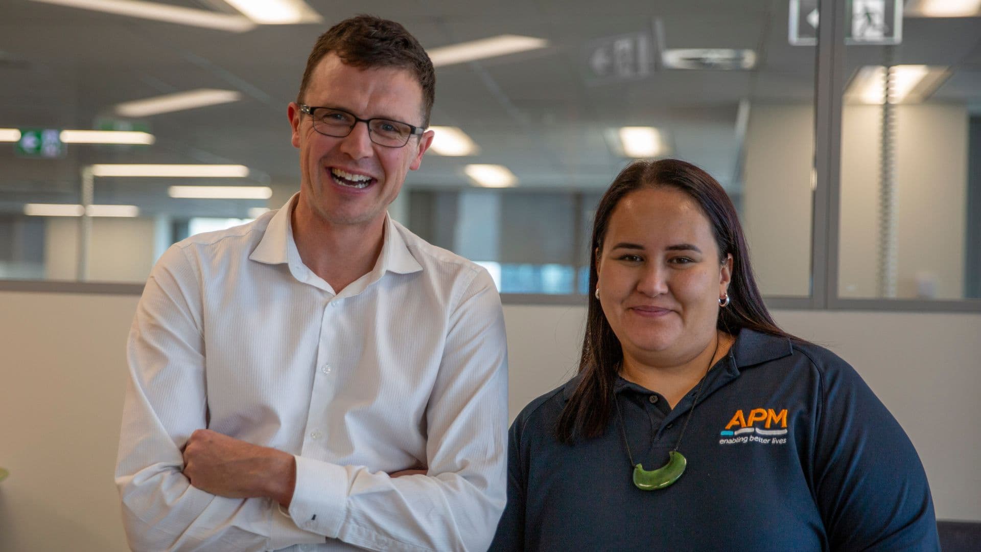 Howden and Candice from APM NZ smiling in office setting