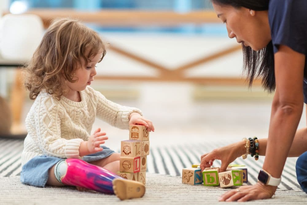 Paediatrician playing games with child