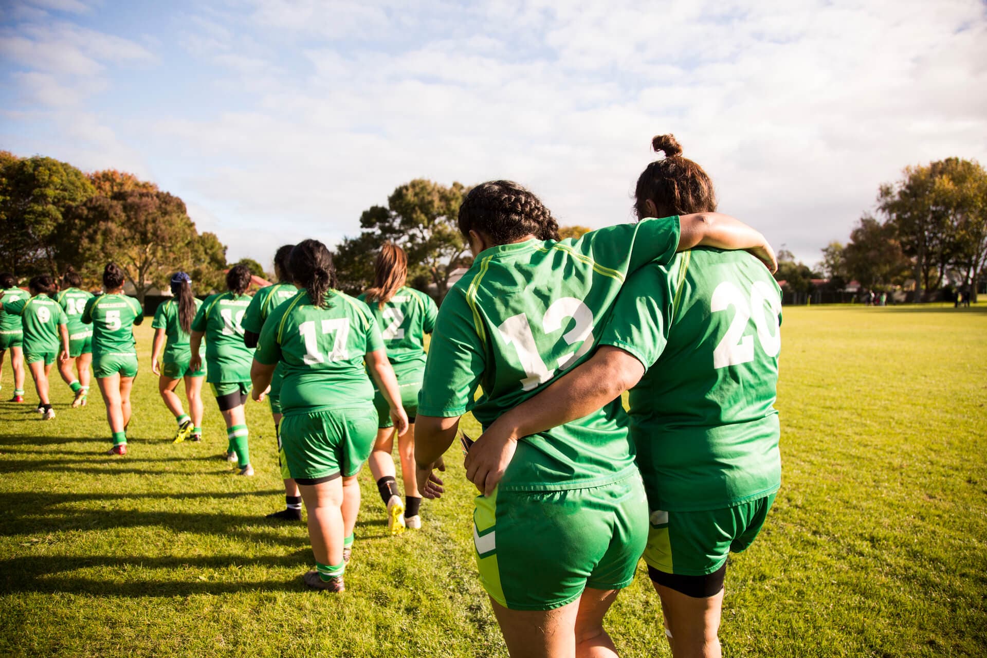 girls sports team walking on field