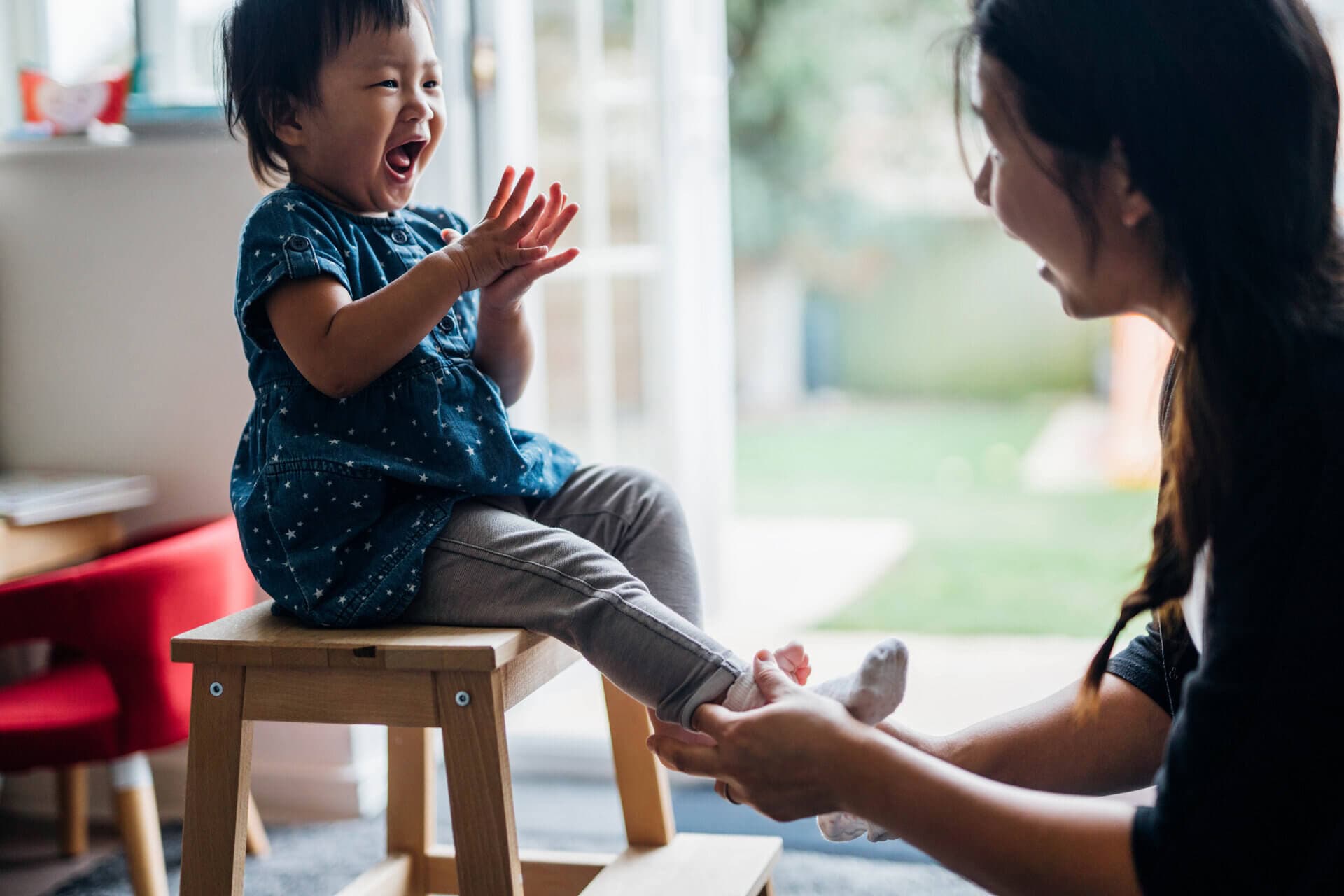 woman laughing with her child