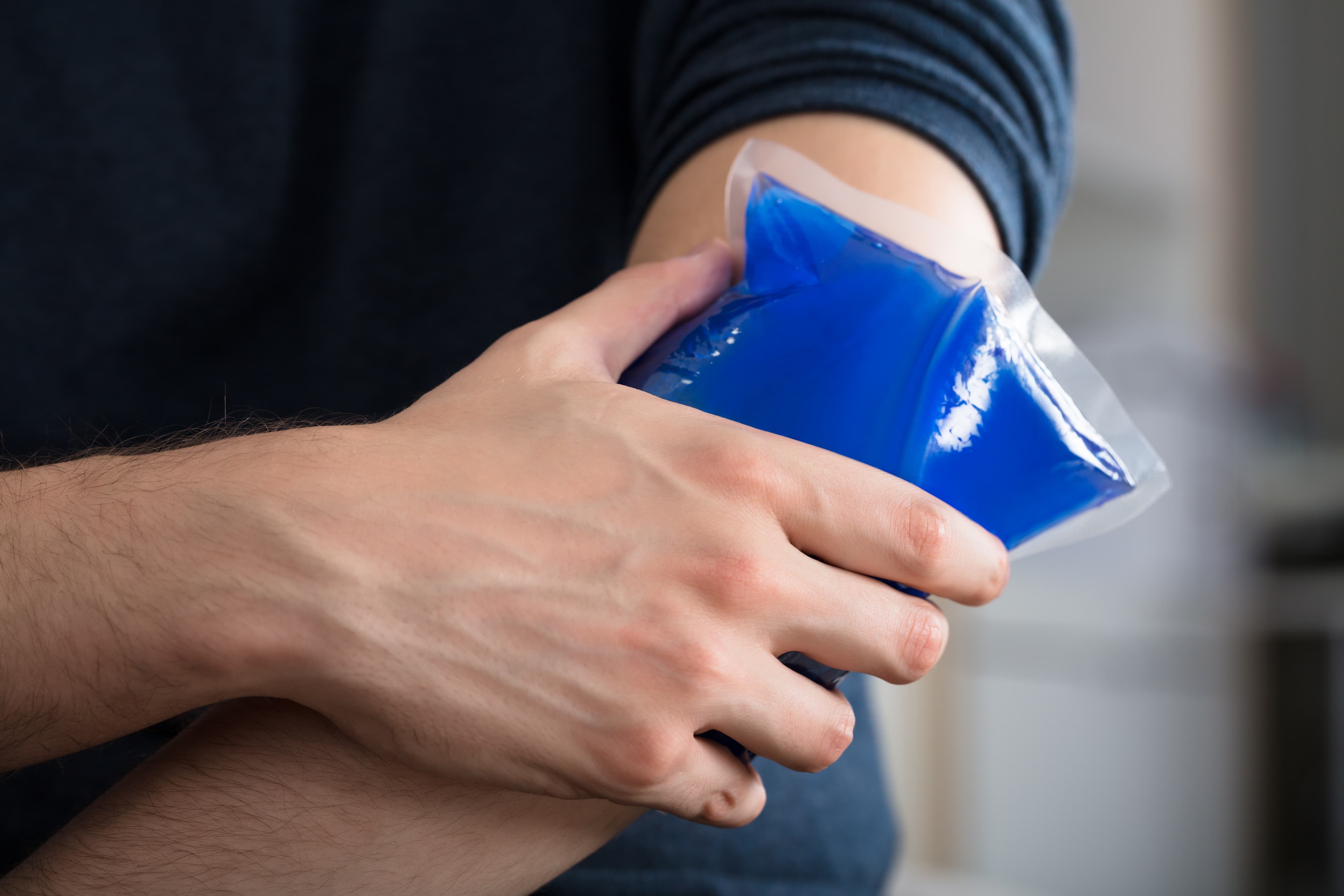 placing an icepack on the elbow