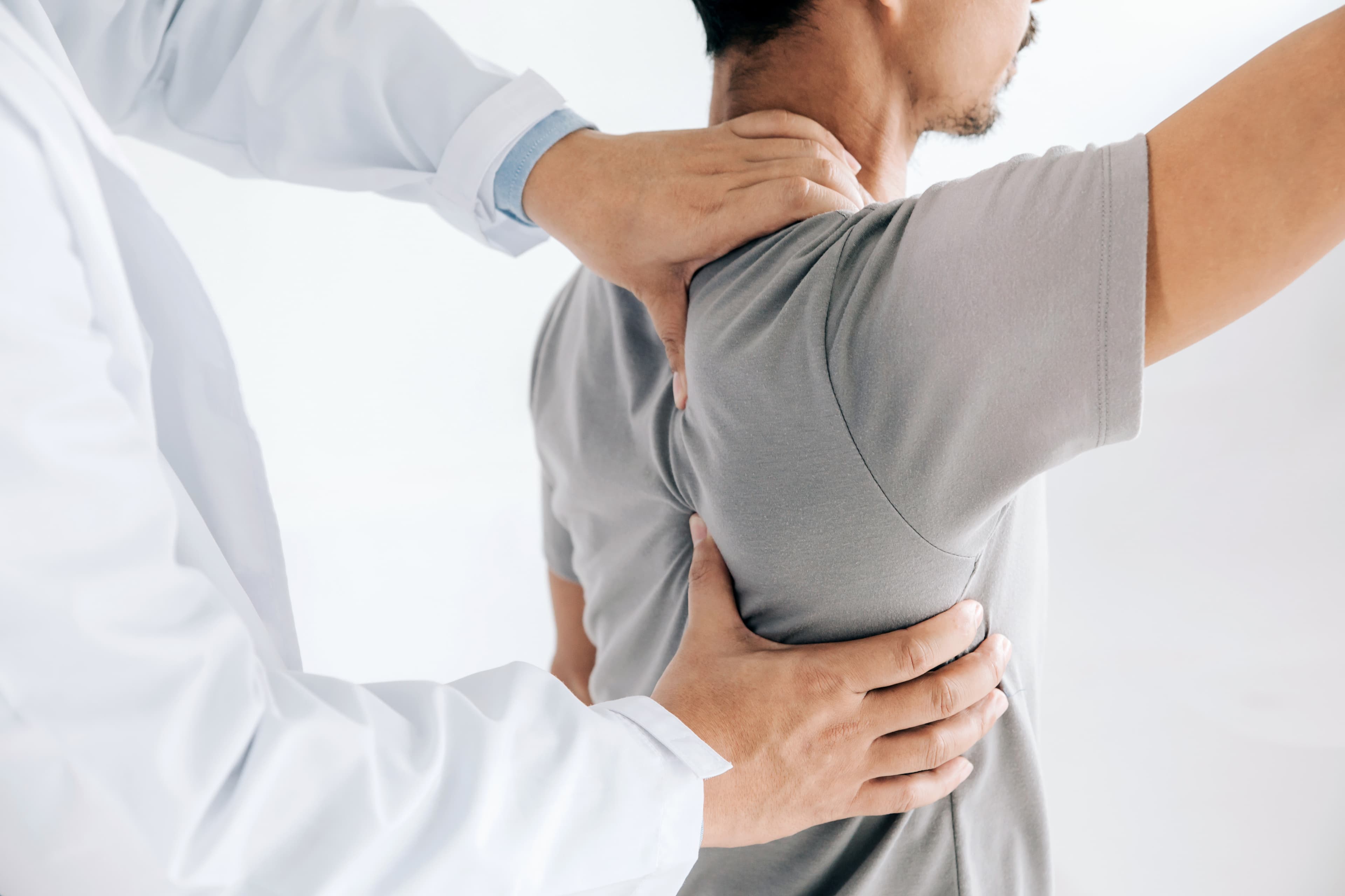 physio assisted massage on shoulder