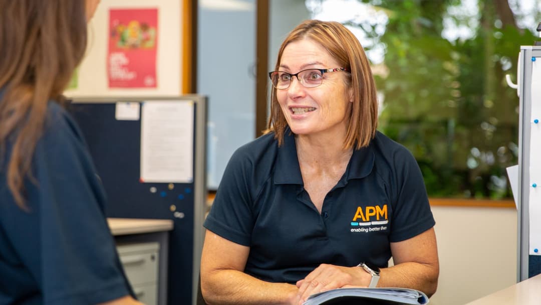 APM team member educating patient about pain management