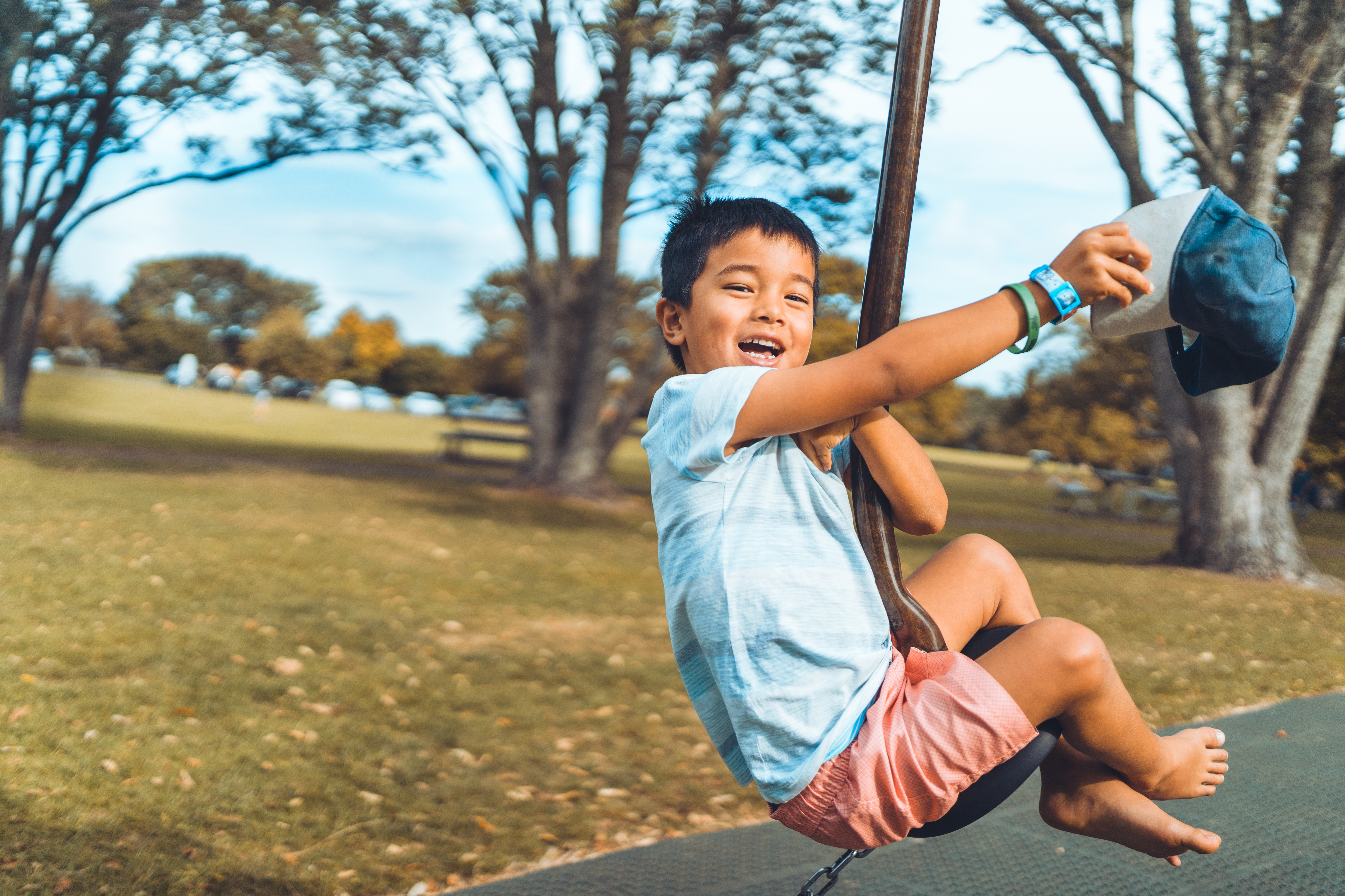 young boy on swing