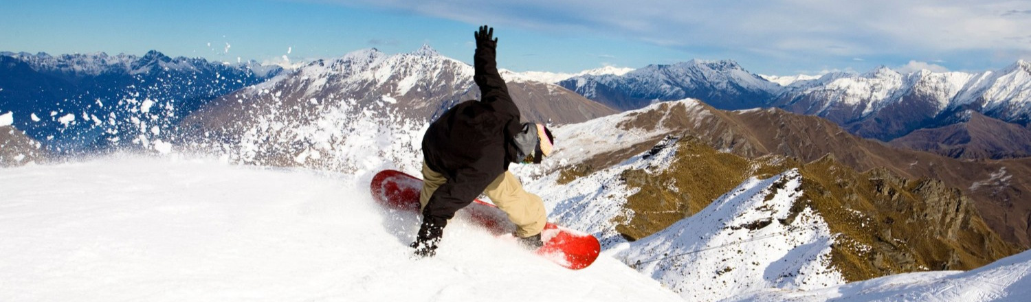 Snowboarder on top of mountain