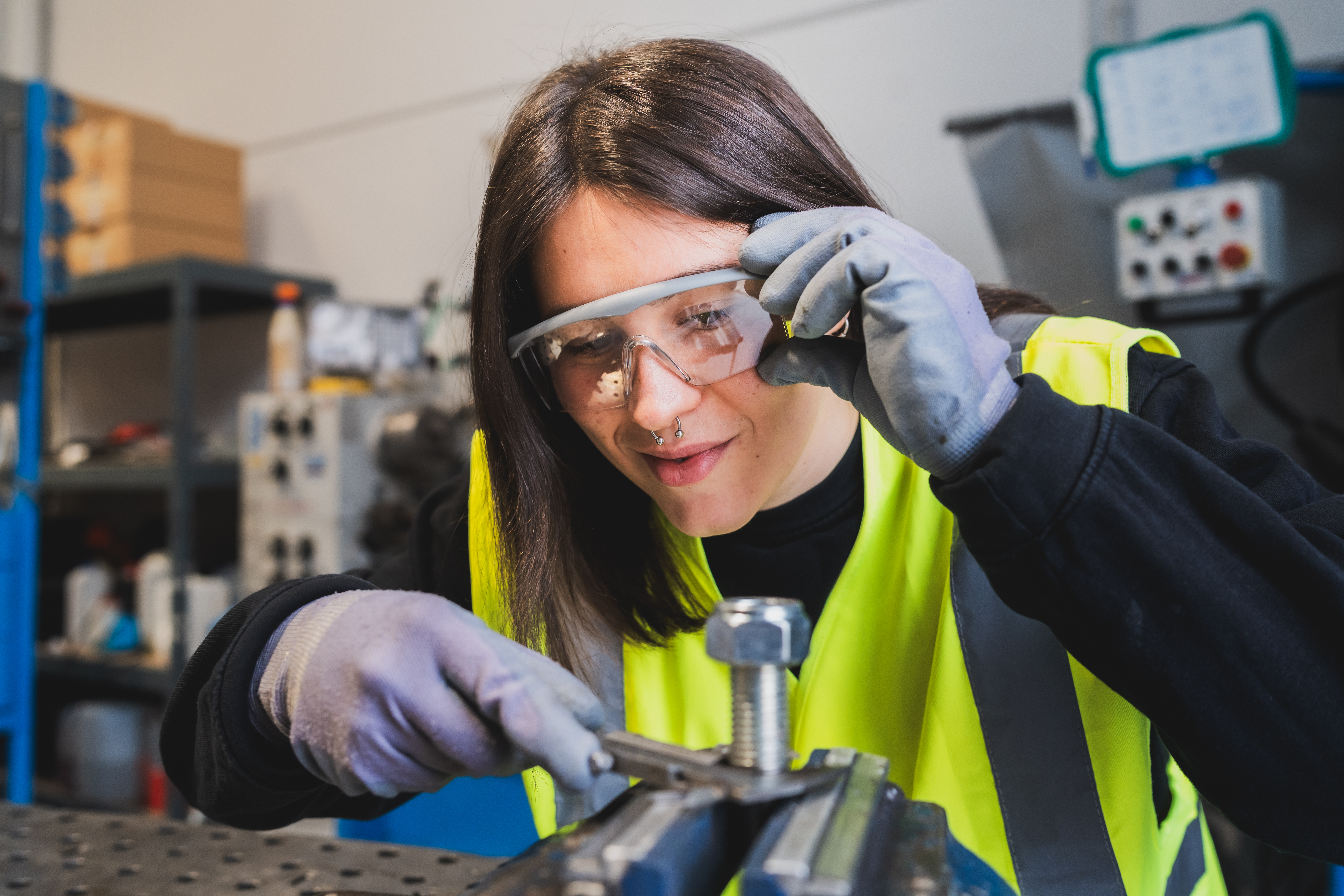 Female Engineer Working On A Wind Turbine Component In A Factory